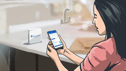 A woman preparing food checks her phone