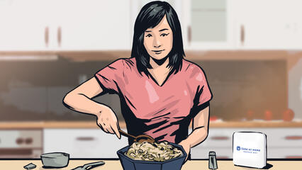 A woman preparing food checks her phone