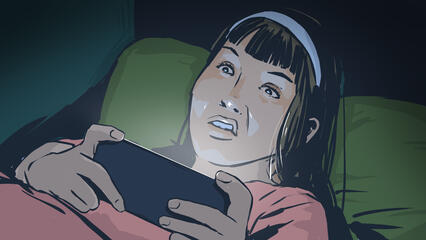 A disinterested woman watches a horror movie on her phone